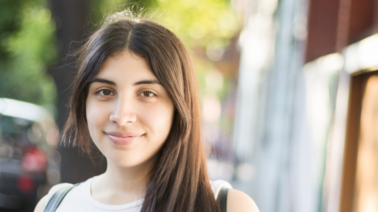 Picture of hopeful young person looking into camera