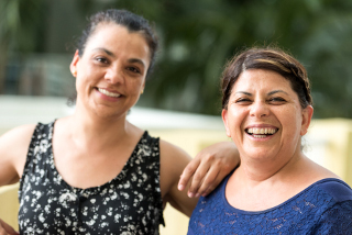 Picture of two sisters sharing a story